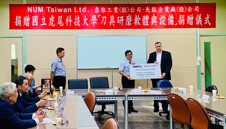 Photo shows the President of the university, Dr. Wen-Yuh Jywe (left) and Adrian Kiener (right), CSO Asia NUM, holding the certificate during the formal handover ceremony