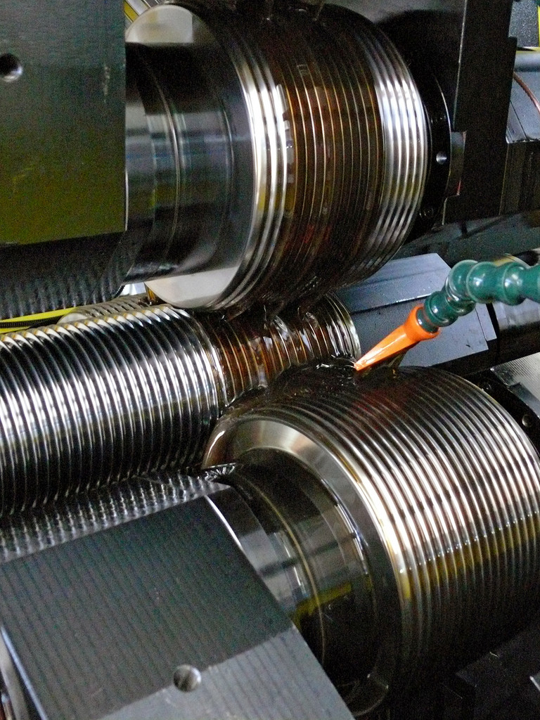 The thread rolling machine in operation.